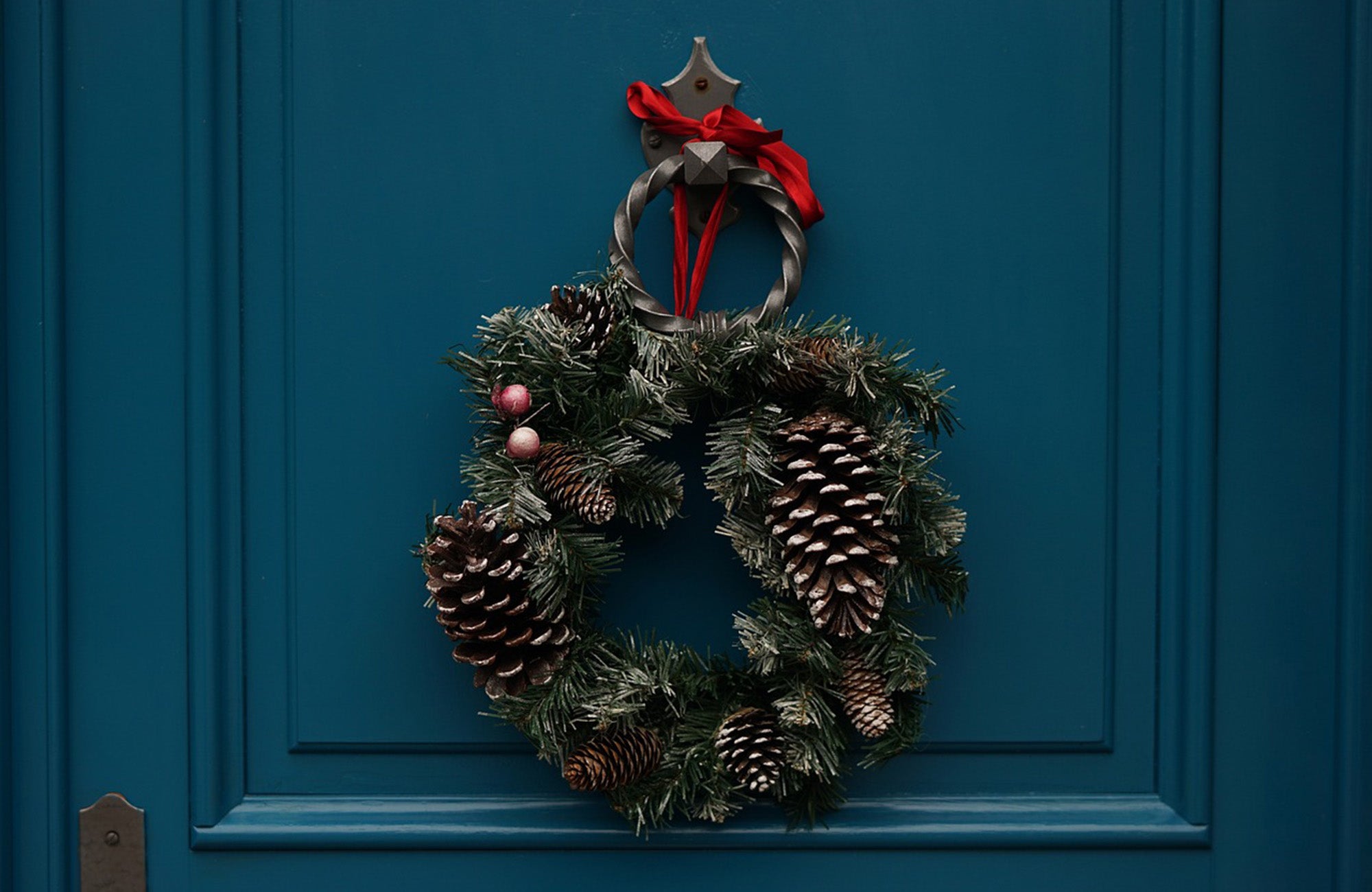 Pine cone Christmas wreath on front door