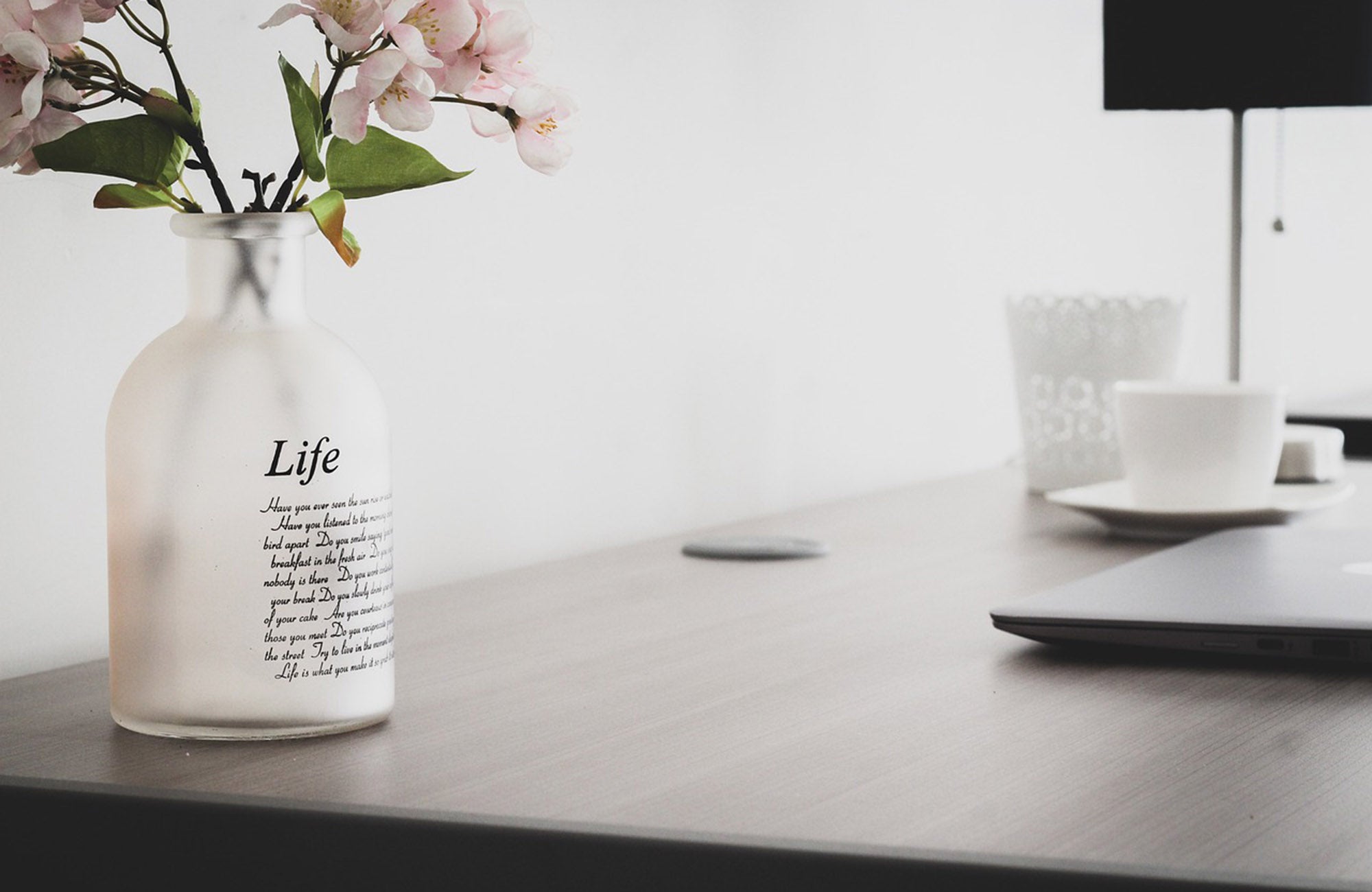 Flower delivery in vase on desk