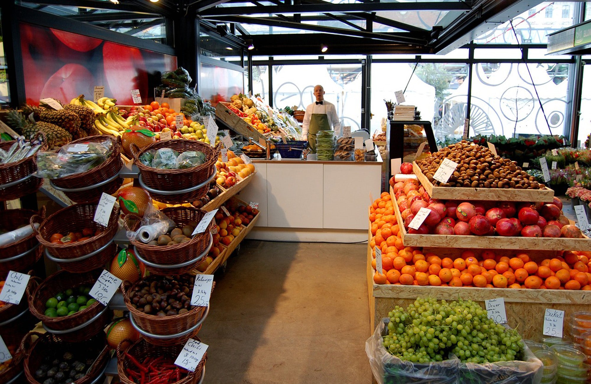 Fruit shop with man at counter