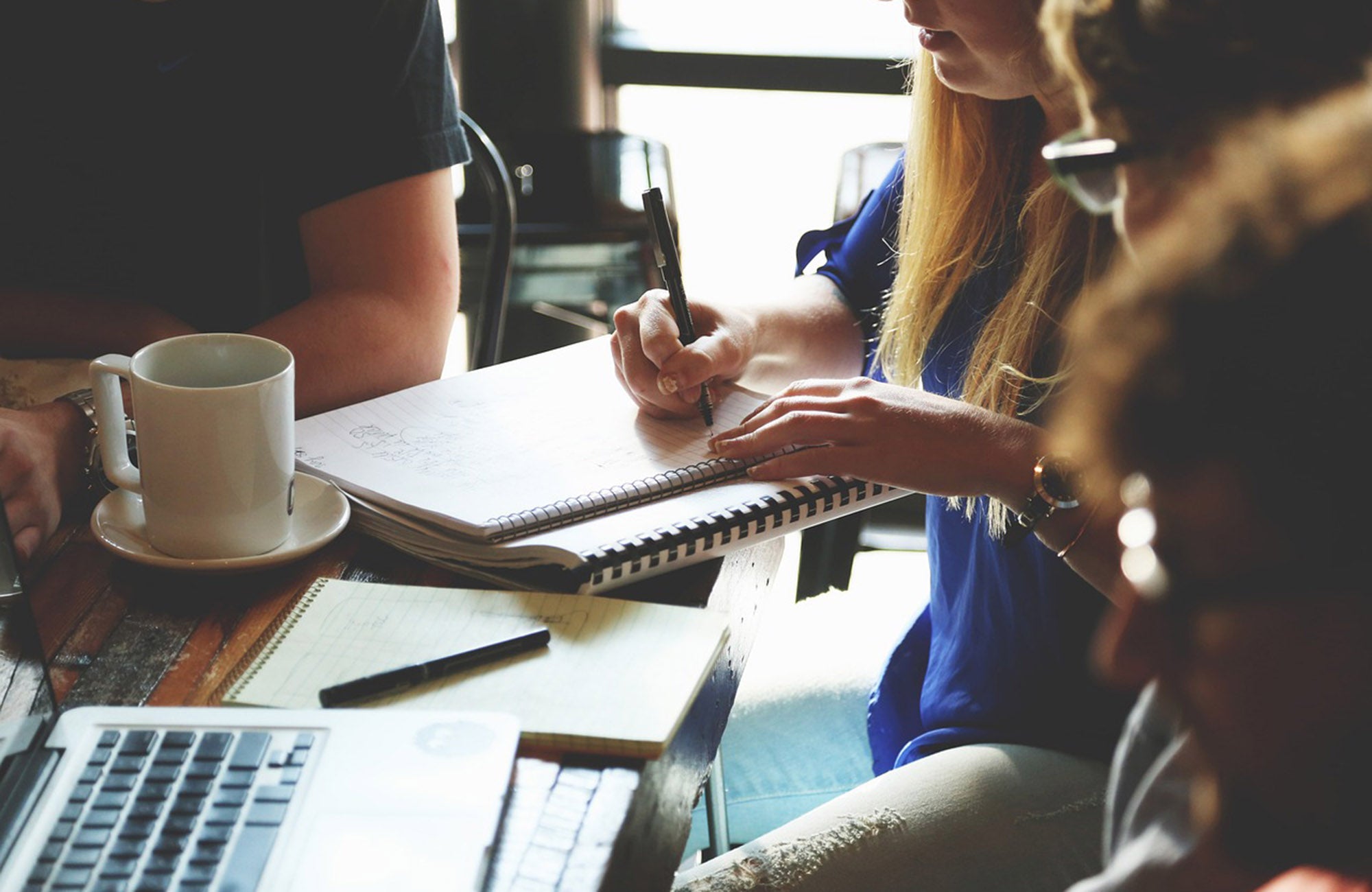 Melbourne office workers having meeting around table