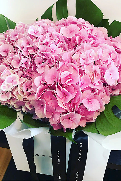 Pink Mother's Day Flower Bouquet consisting of hydrangea on shop shelf ready for delivery