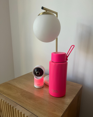 hot pink frank green bottle and vtech baby monitor