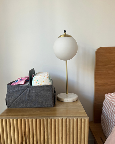 grey nappy caddy in stylish modern bedroom