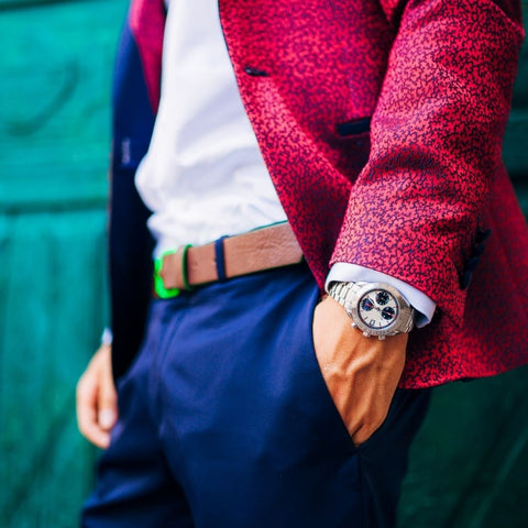 man wearing watch with hand in pocket