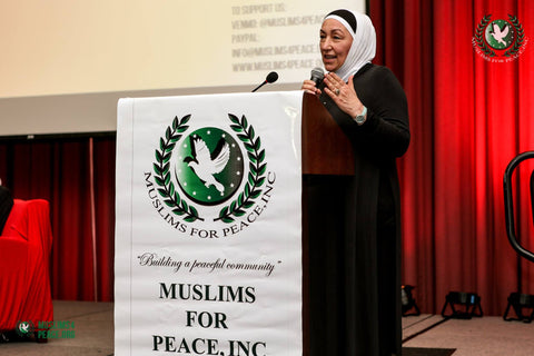 najah bazzy speaking at a conference