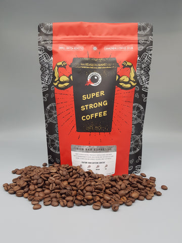 bag of iron bag espresso on a pile of roasted coffee beans