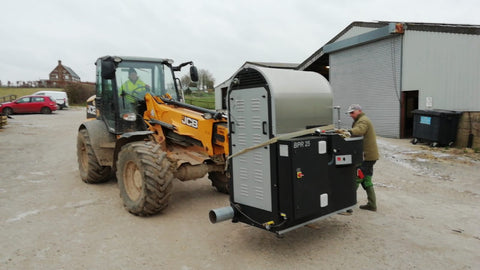 moving the coffee roaster on a jcb