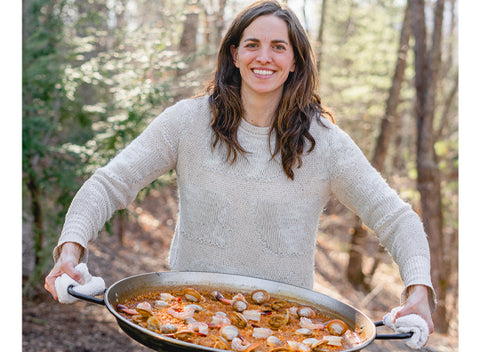 Chef Katie Button of Cúrate cooks Paella over open fire.