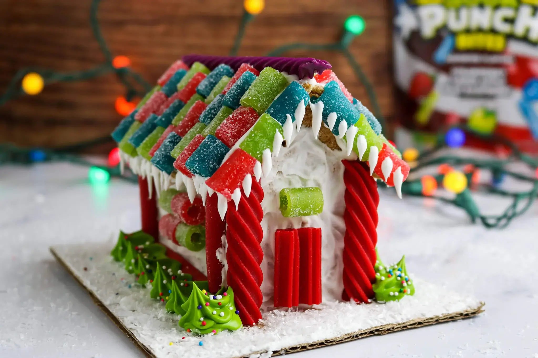 Graham cracker gingerbread house featuring Sour Punch candy and Red Vines candy