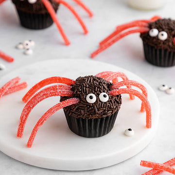Decorating Cupcakes for Halloween: Sour Punch Spider Cupcakes with Sour Punch Strawberry Straws as the Legs