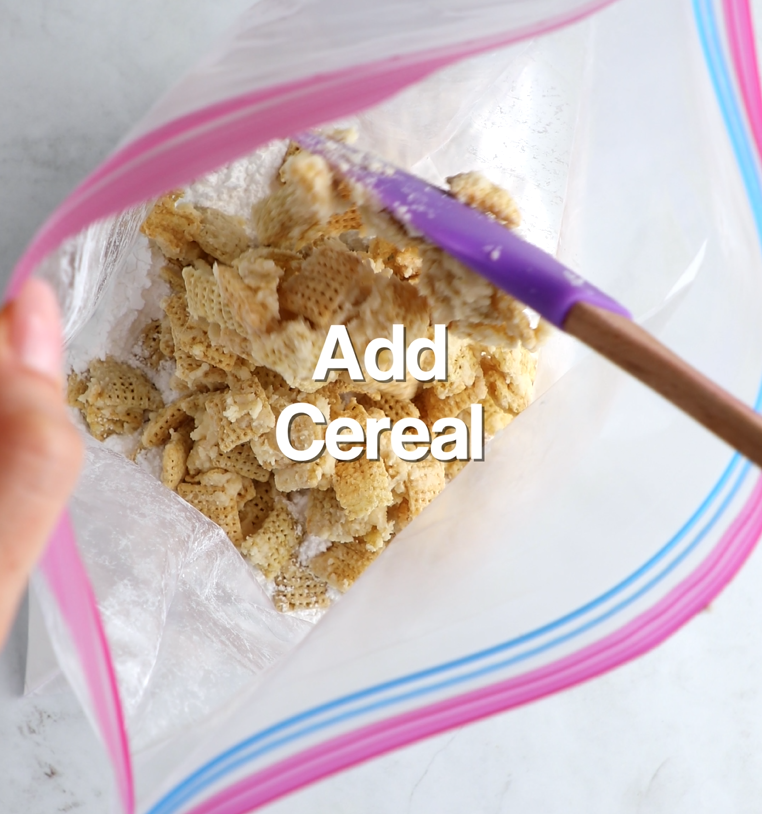 Coated cereal added to bag of powdered sugar