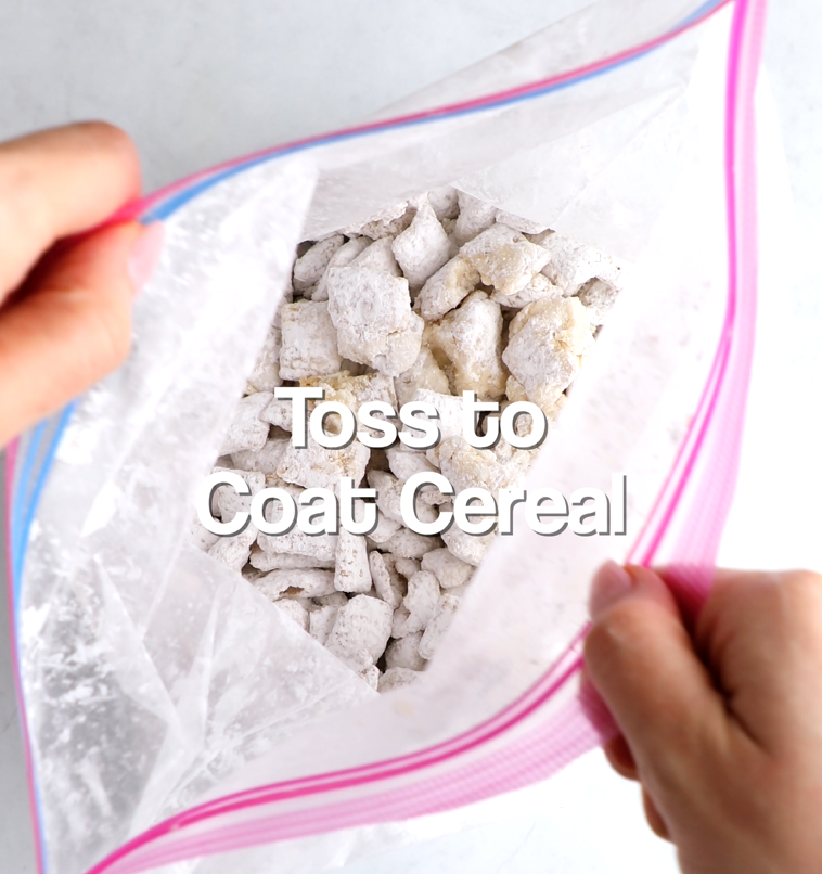 Cereal and powdered sugar being gently tossed together