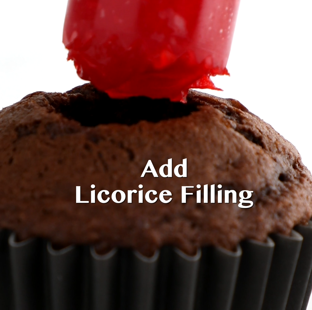 Gooey red licorice filling piped into cupcake centers