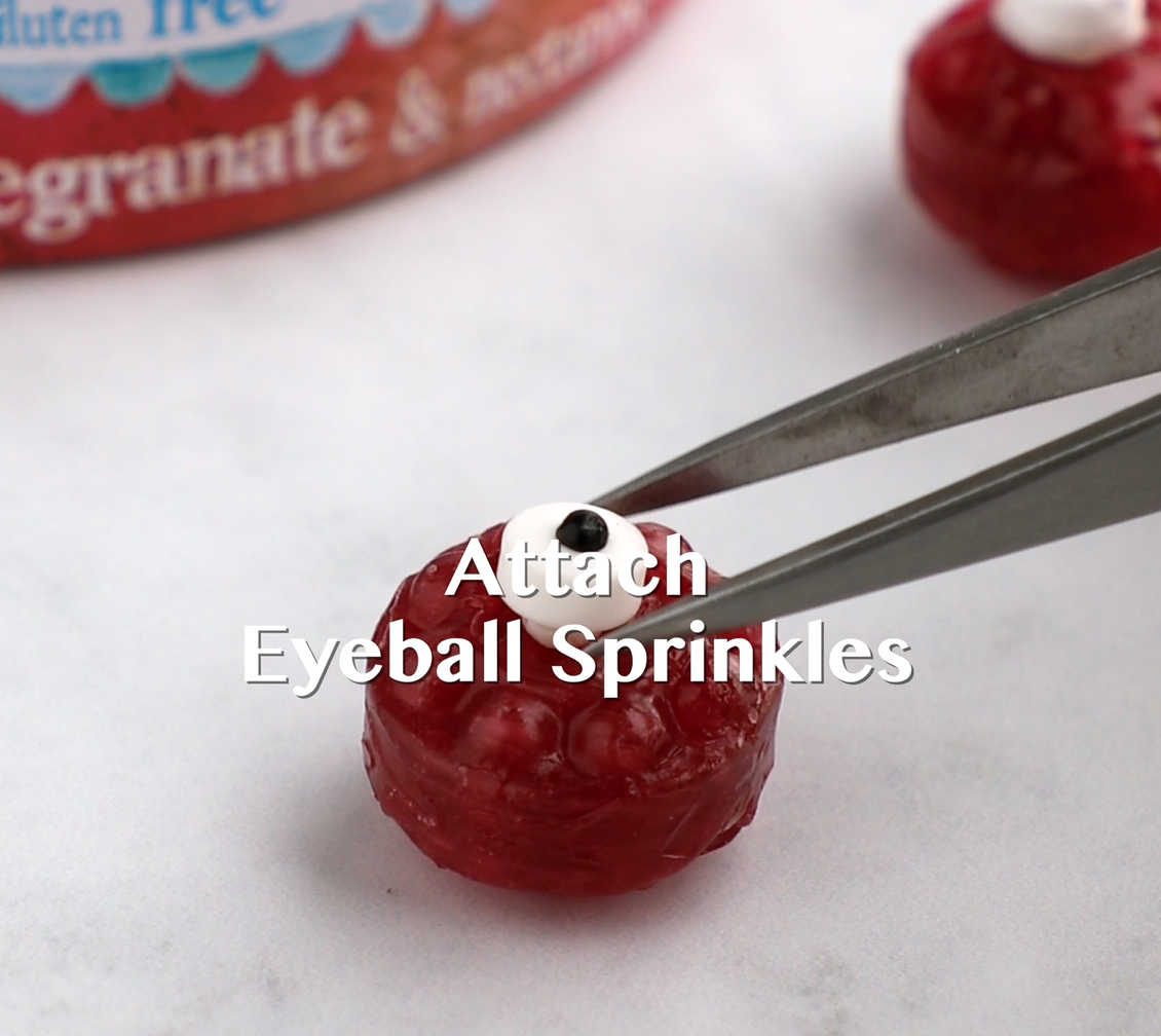 Eyeball sprinkles being attached to Torie & Howard Hard Candies