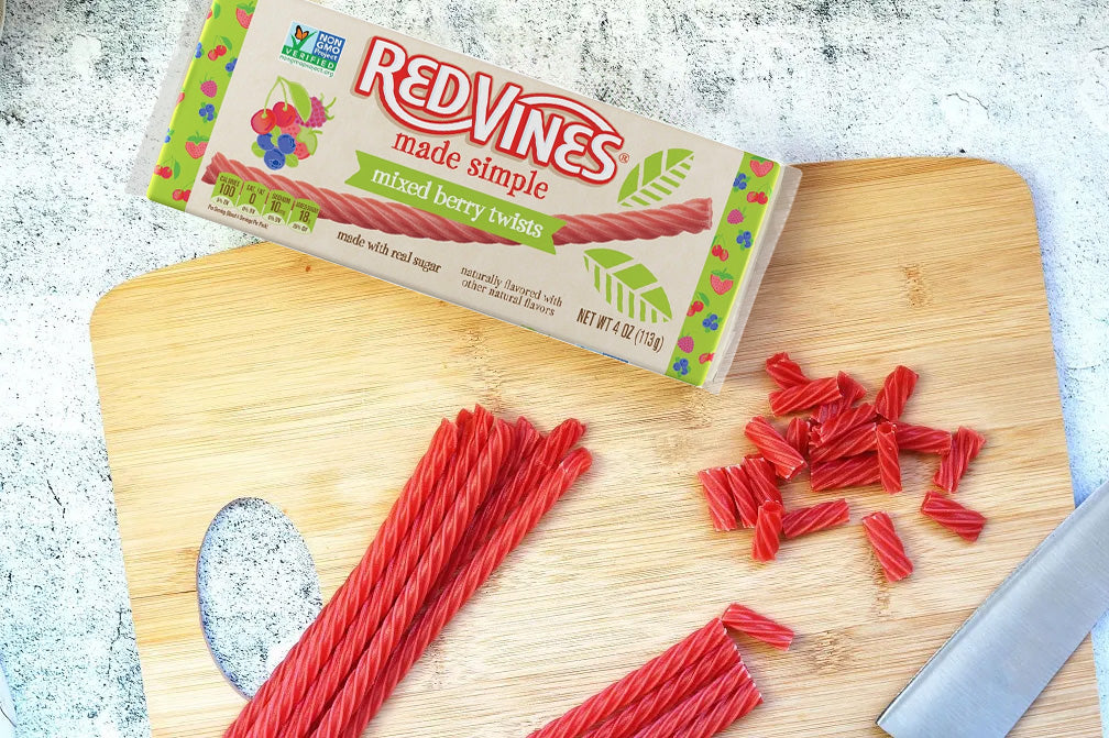 Red Vines Made Simple Mixed Berry Licorice with a knife and cutting board
