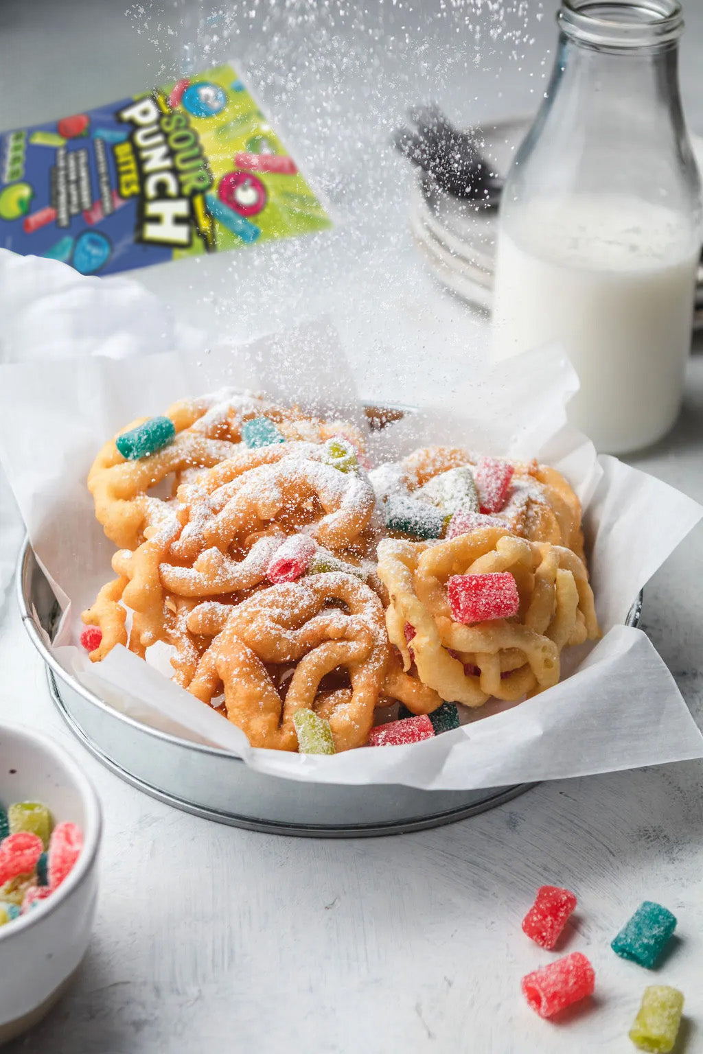 Funnel cake topped with Sour Punch Assorted Bites and powdered sugar