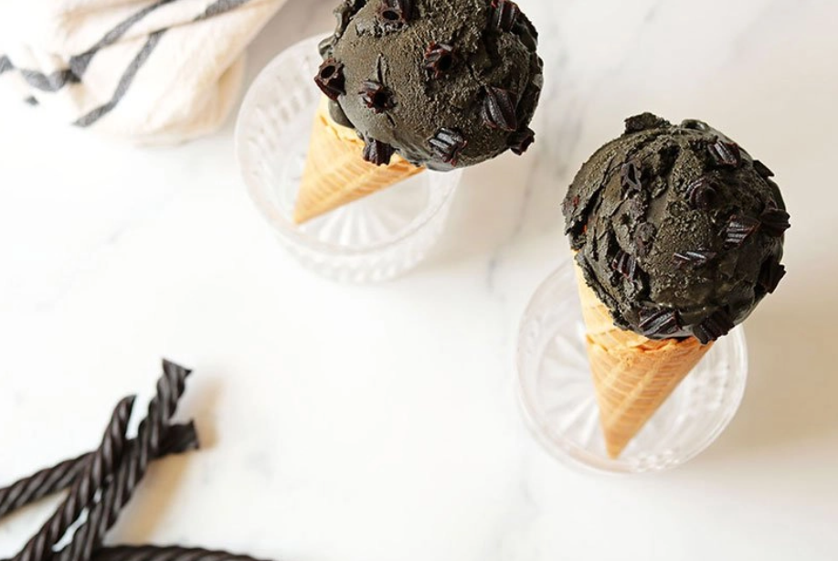 Salted Black Licorice Ice Cream in waffle cones and small serving dishes