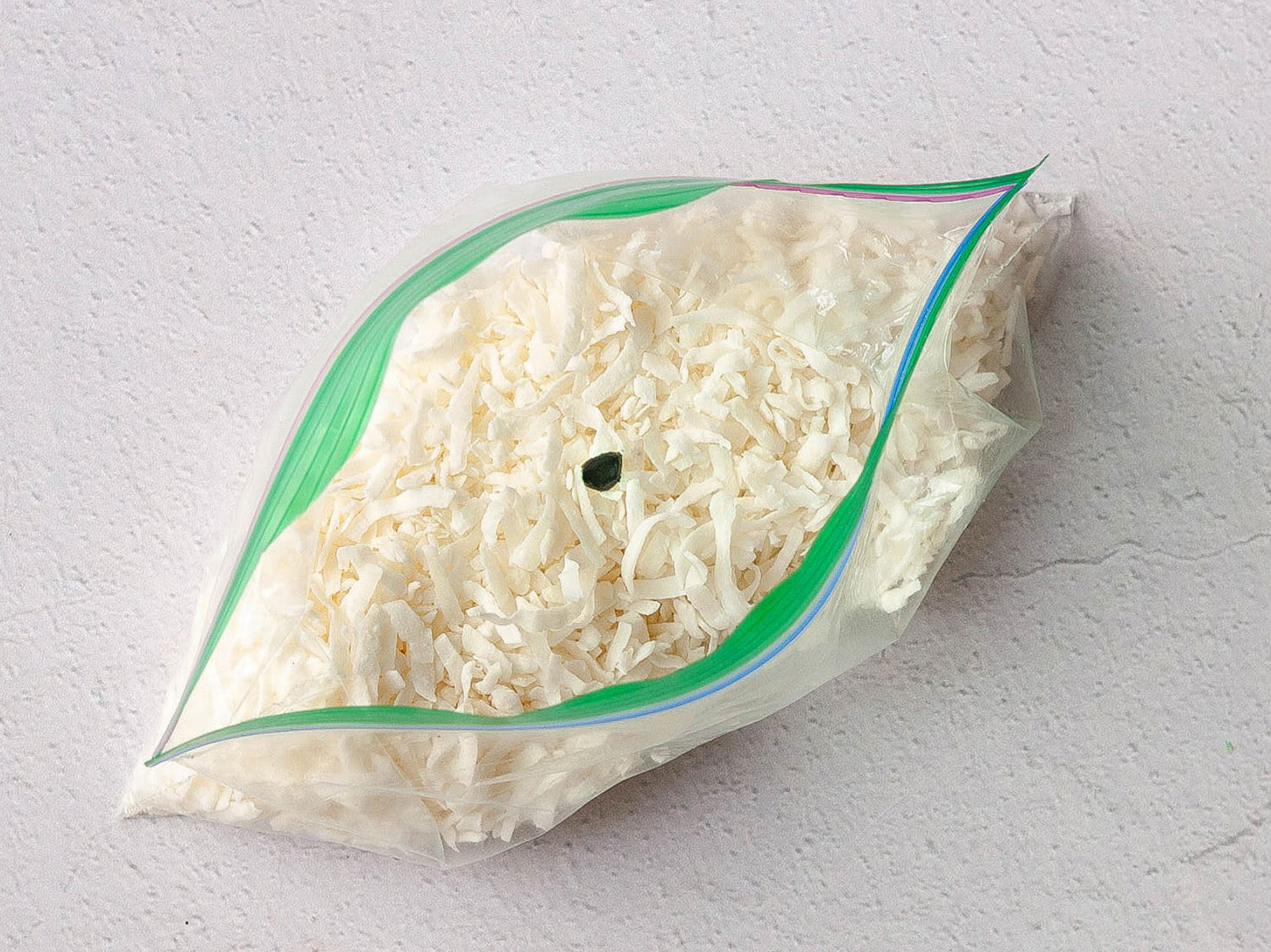 Shredded coconut in a plastic bag