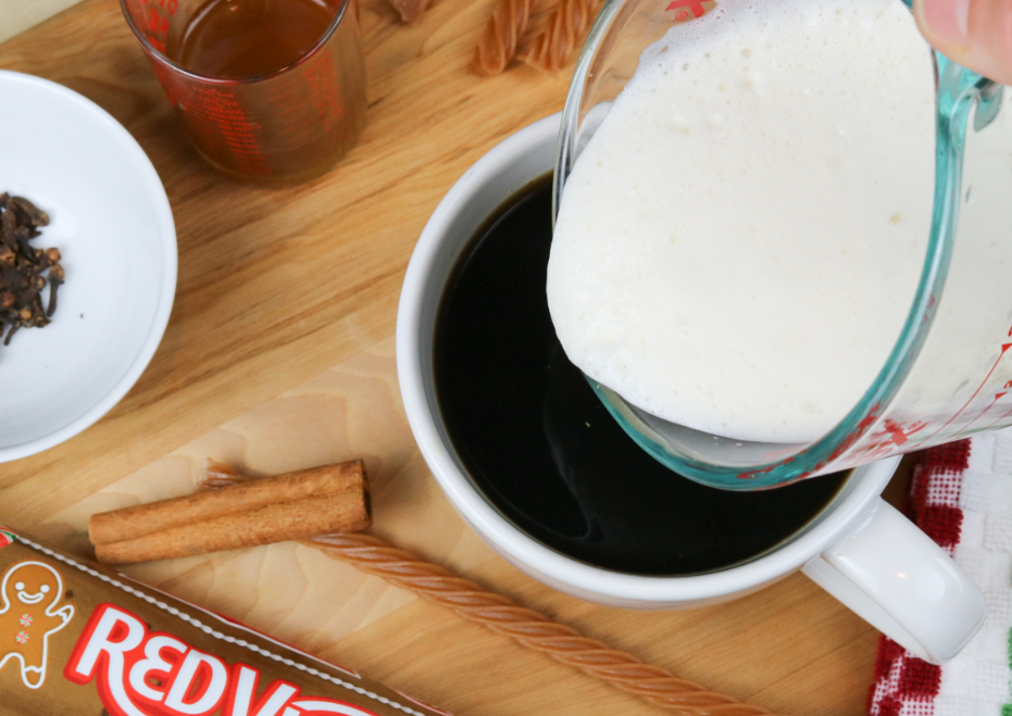 Foam being poured over coffee