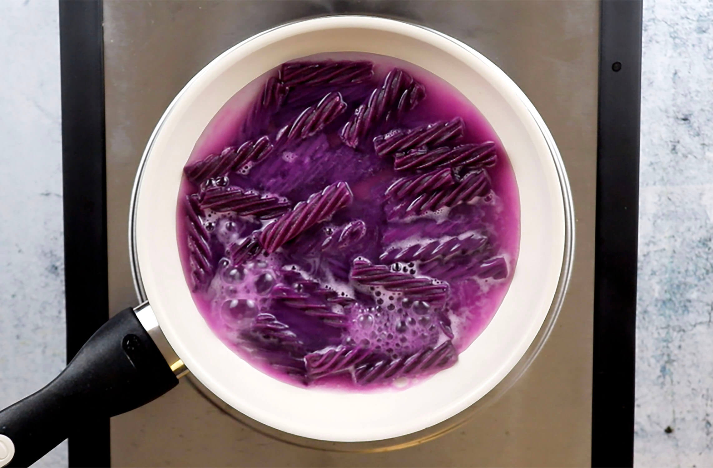 Melting Grape Licorice with a little bit of water in a pot