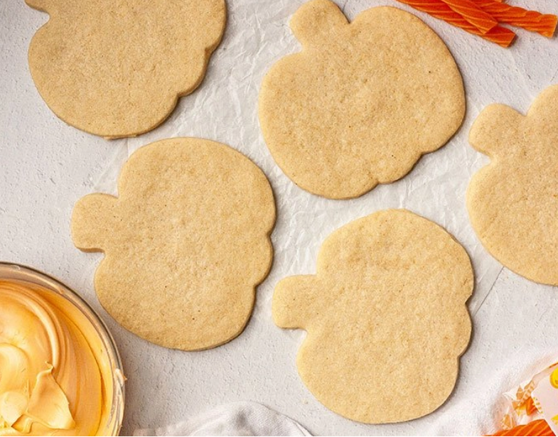 Baked and cooled pumpkin shape cookies