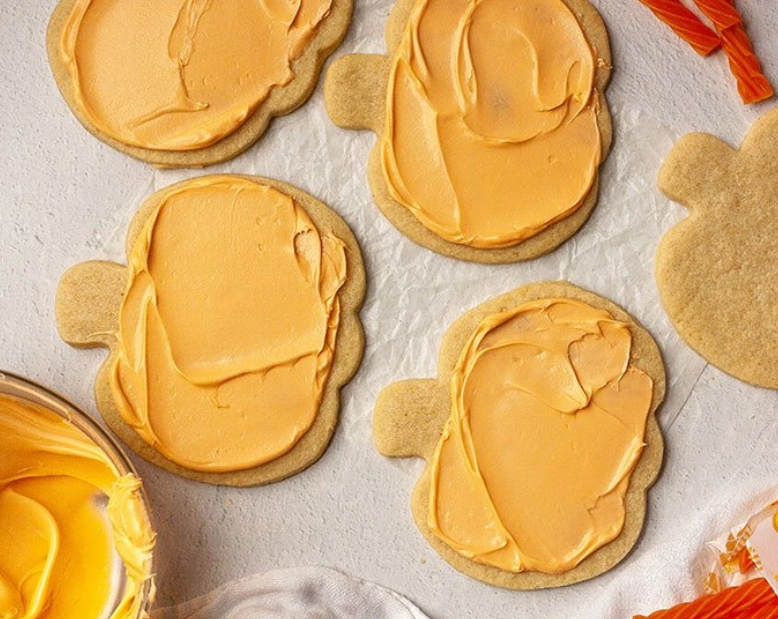 Cookies frosted with light orange frosting