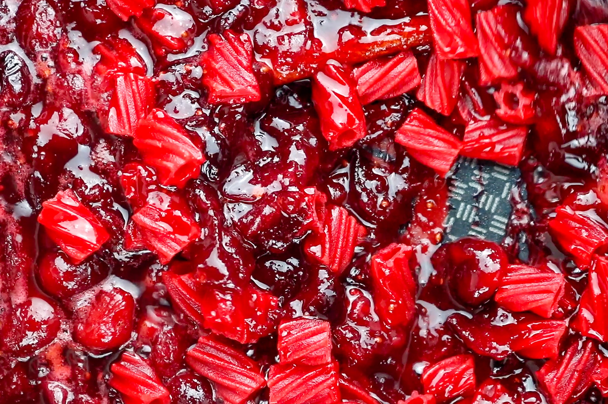 Cranberries breaking down and Red Vines melting in a skillet