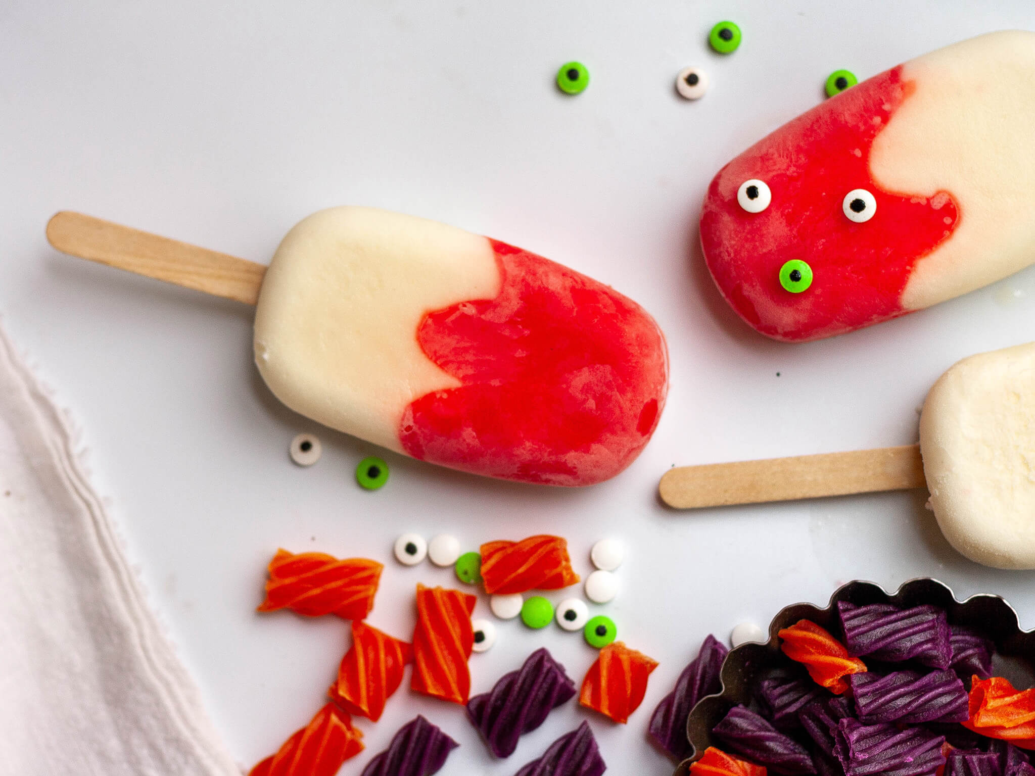 Popsicles decorated with candy eyeballs