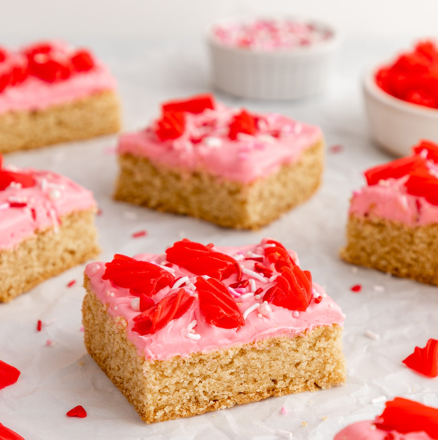 Sugar Cookie Bars with Strawberry frosting, Red Vines, and sprinkles