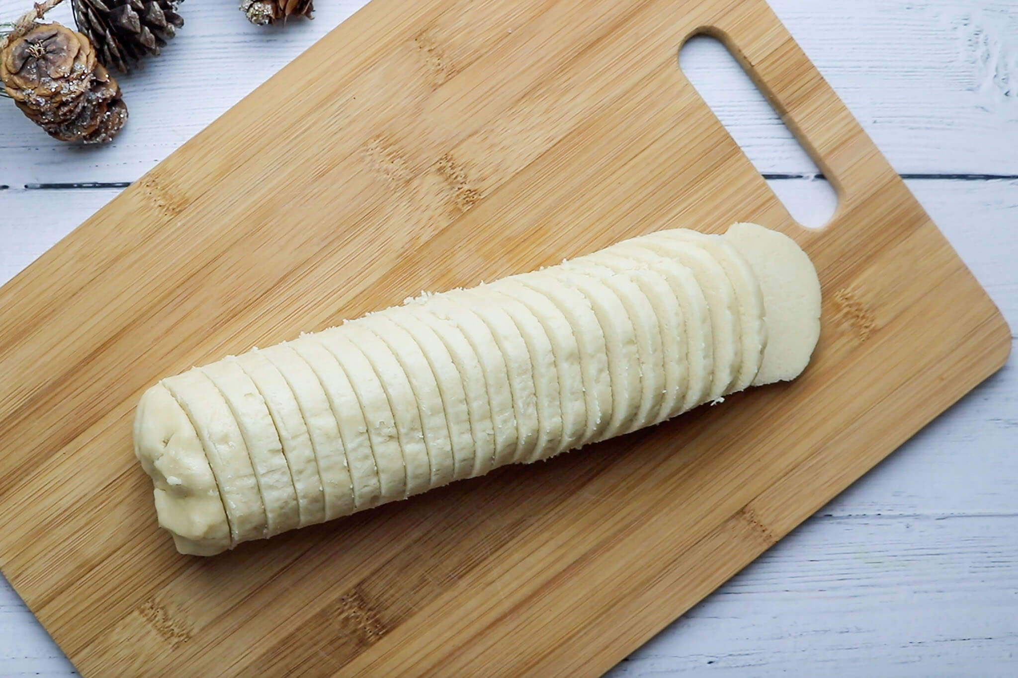 Sugar cookie dough tube sliced evenly