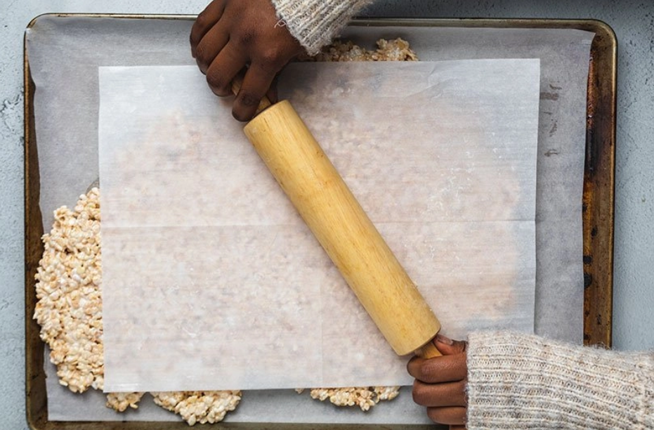 Mixture being flattened with a rolling pin