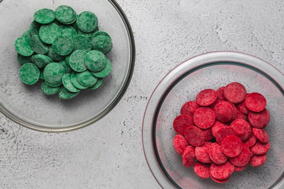 Green and red candy melts in separate bowls