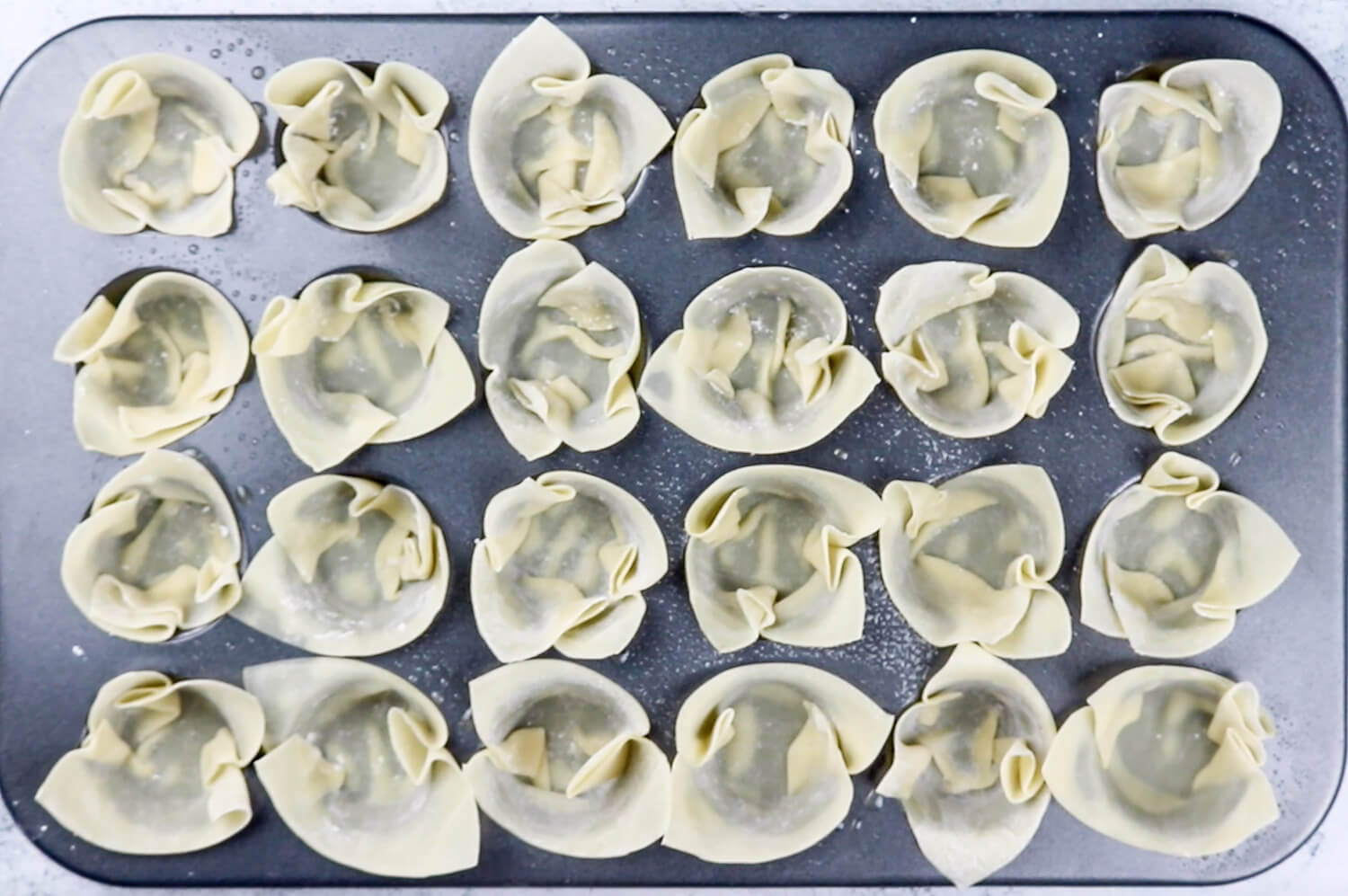 Wonton Wrappers in muffin tin