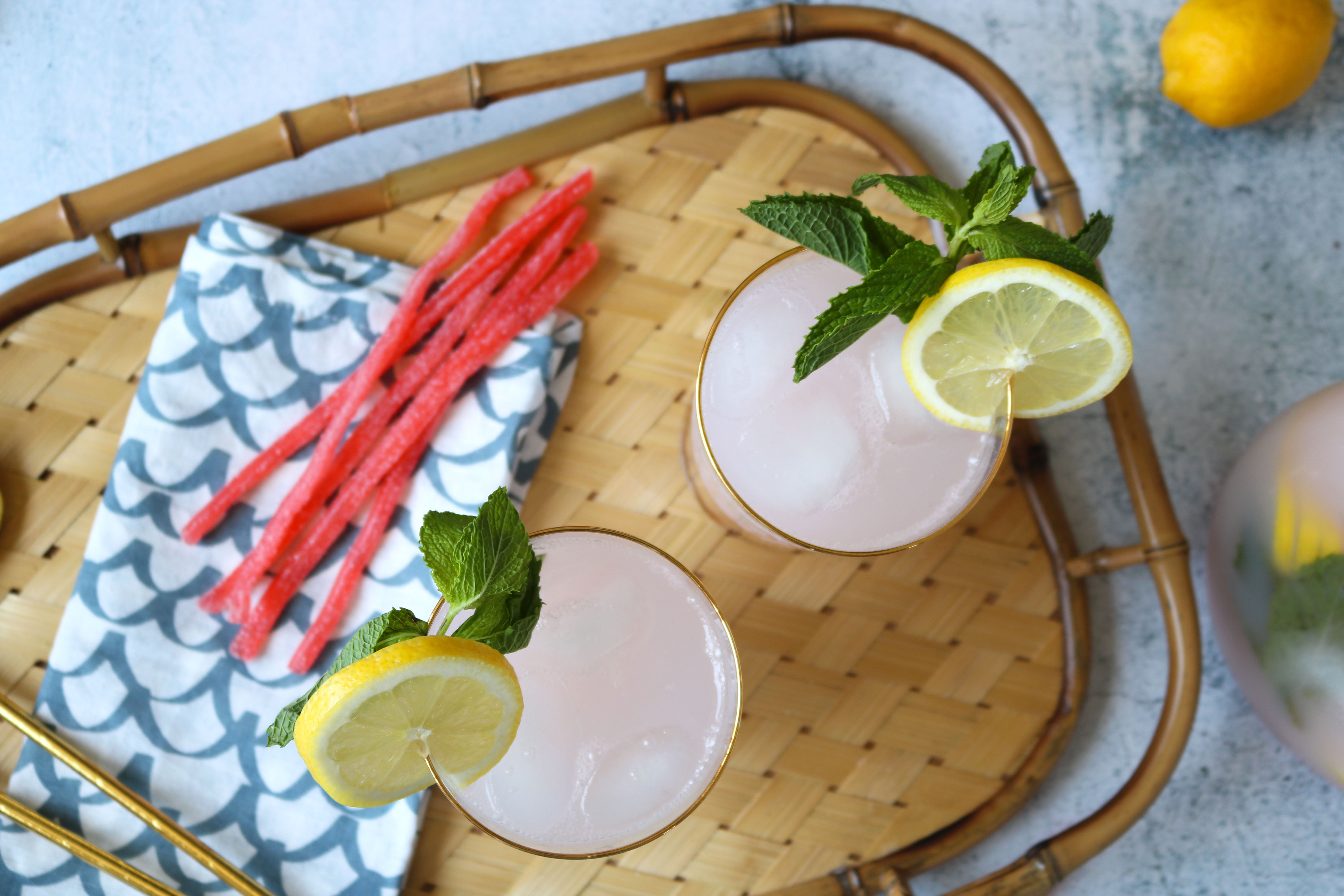 Lemonade in glasses with lemon and mint garnishes