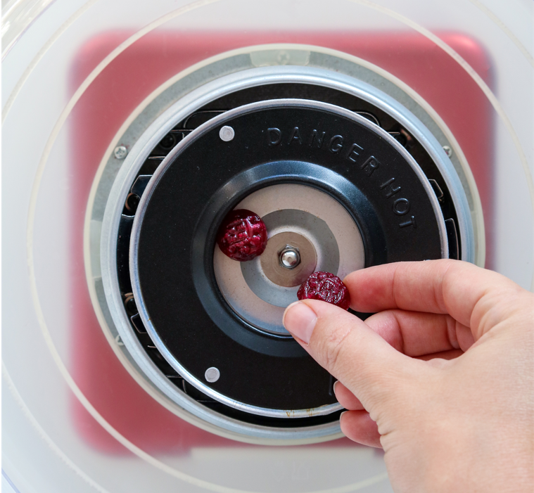 Organic hard candy being placed into cotton candy machine