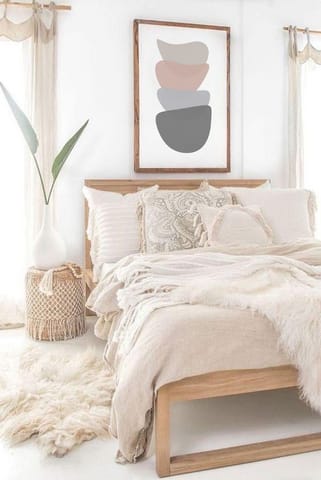 neutral bedroom decor with aesthetic bedding and wooden bead decor