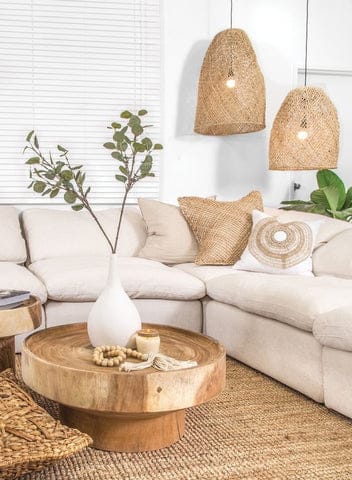 neutral living room decor with wooden beads on coffee table, and woven lighting pendants