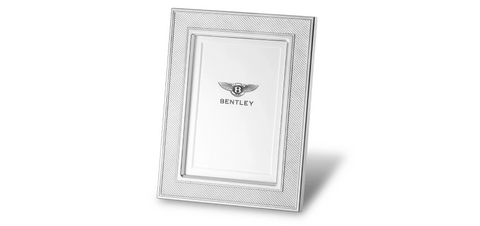 Photo frame with silver engraved frame