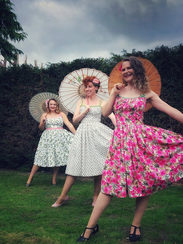 Front to back-Anya, Irene and Rach in a 'social distanced' photo wearing their self made Marilyn Dress