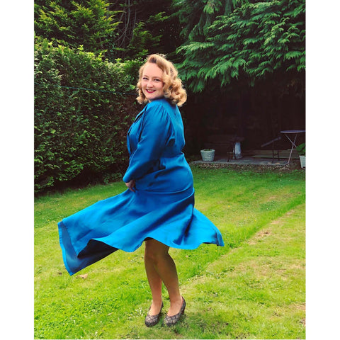 Ms Carnivale wearing a blu silk coachman robe housecoat made using our graded pattern and fabric from Amo threads