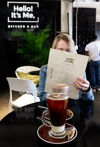 kitchen and bar, woman looking at the menu