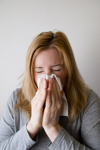 woman sneezing