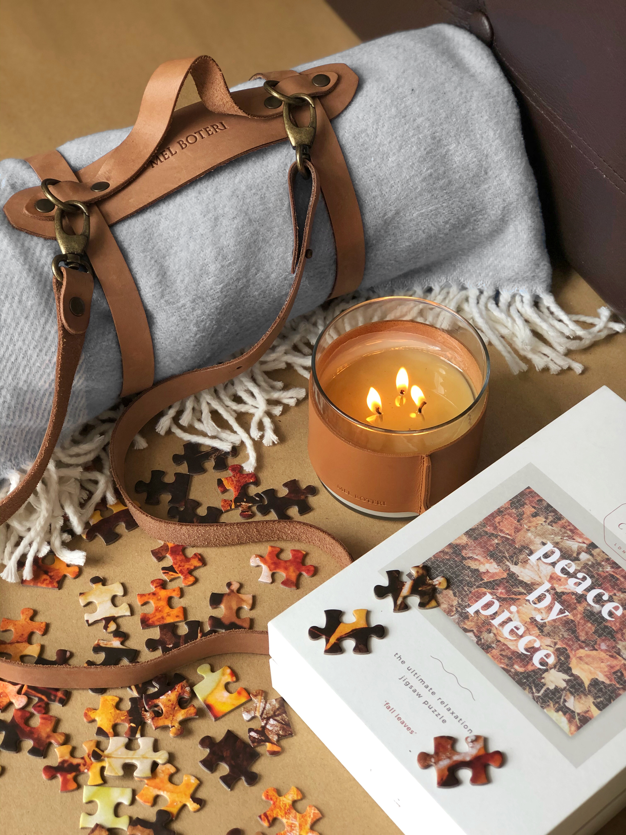 25 Professional Corporate Gift Ideas Under $100 | Mel Boteri Fashion Partners | Leather Wrapped Candle and Blanket With Leather Carrying Straps