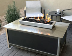 A rectangular stainless steel IMPACT Fire Table with Silver Vein powder coated side panels