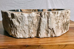 front view of a petrified wood vessel sink showing the highly textural exterior