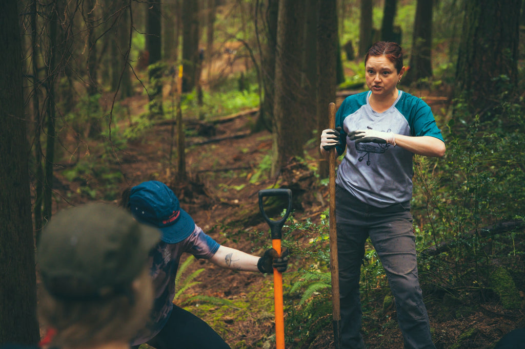 Sarah Brassil talks to volunteers at a Steed trail day