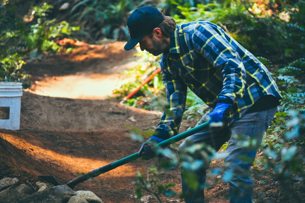 Steed Cycles trail day, shaping a berm on Pennzoil