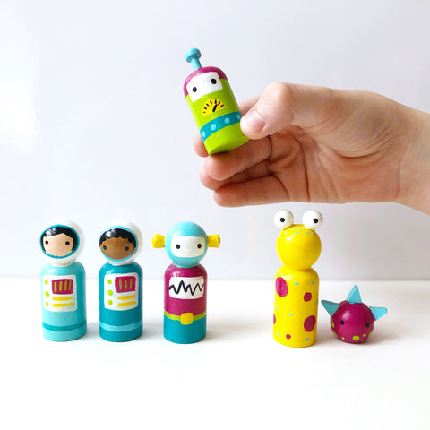 Space themed peg dolls