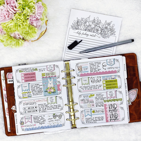 Weekly Planner with Stickers on it