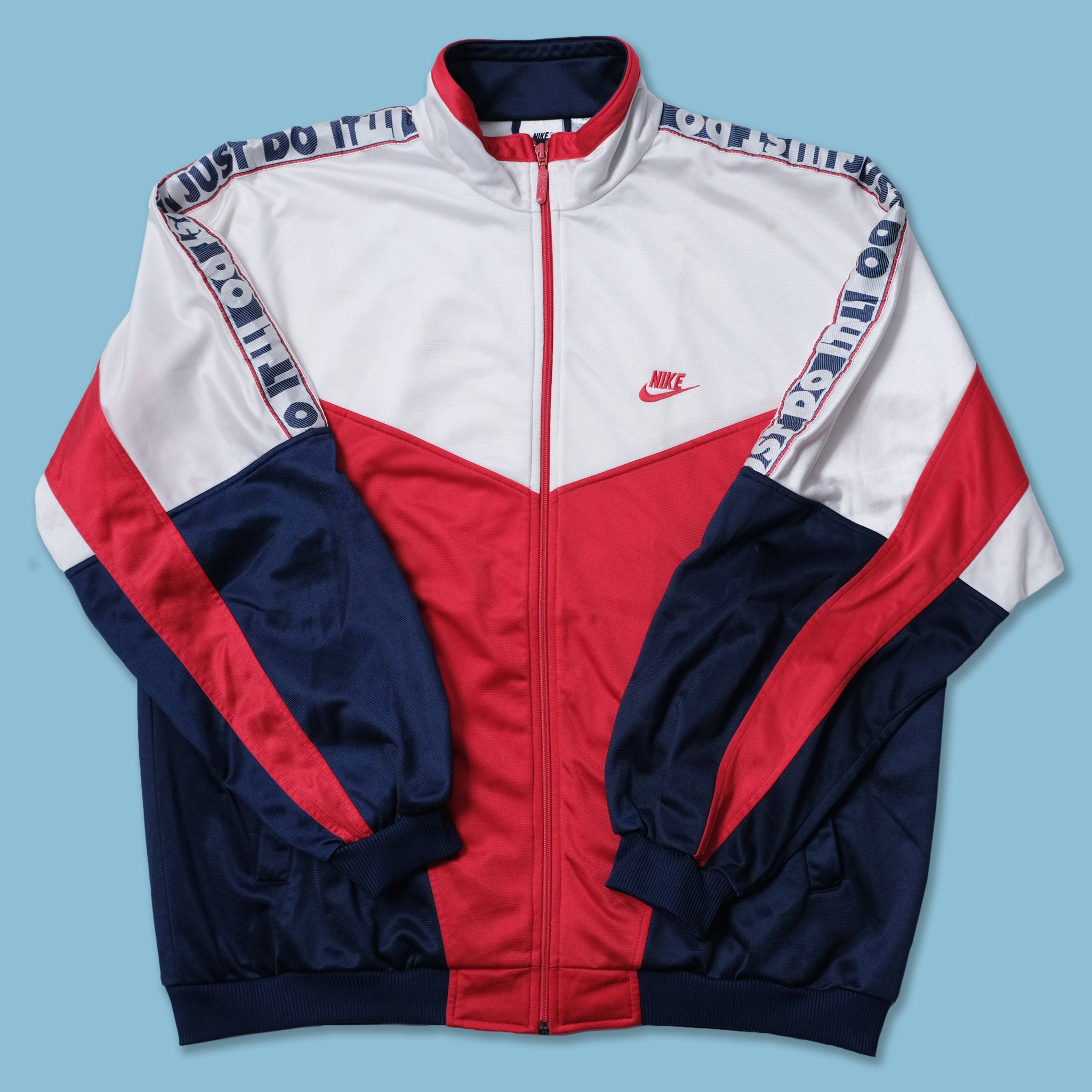 nike taped track top